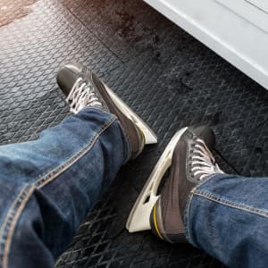 Black rental ice skates on teen