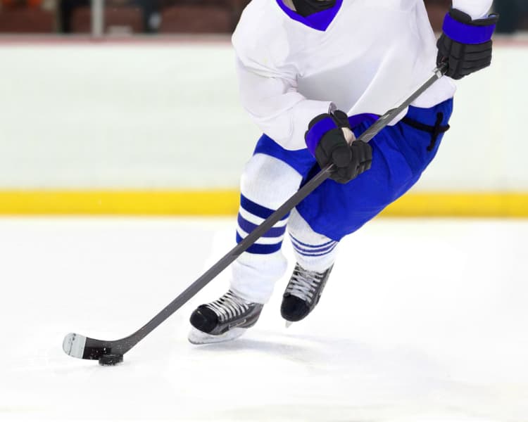 Player Icing a puck in Hockey