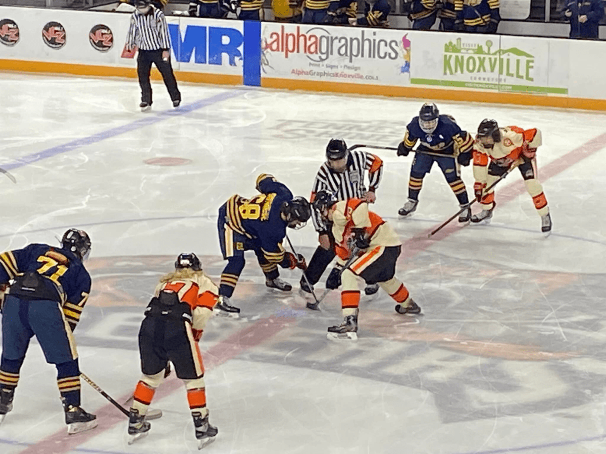 Two offensive lines at a face-off.  Both lines have 3 players on the offensive forward line